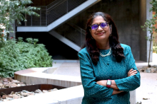 Sadhana Ravishankar poses in the courtyard of ENR2 Building on UArizona main campus
