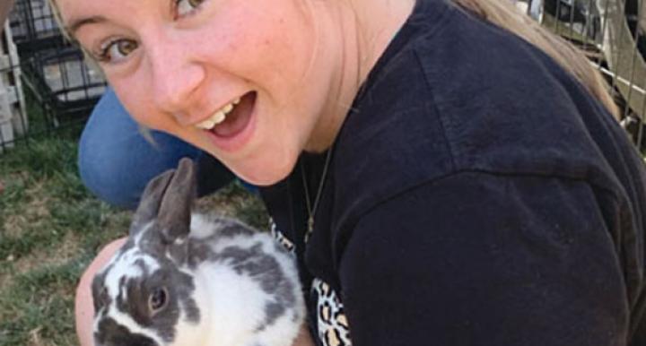 Student holding rabbit