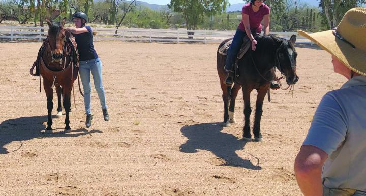 Students practice dismounting from their horses