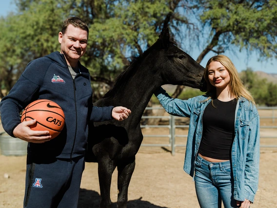 Coach Lloyd posing with his daughter, Maria, and Coach Lloyd's Legacy