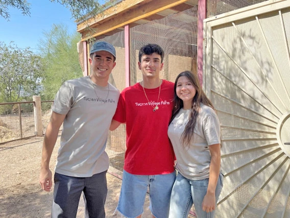 Three students standing together