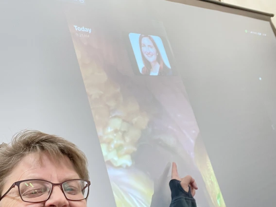 Dr. Greene pointing to video of screen displaying horses mouth