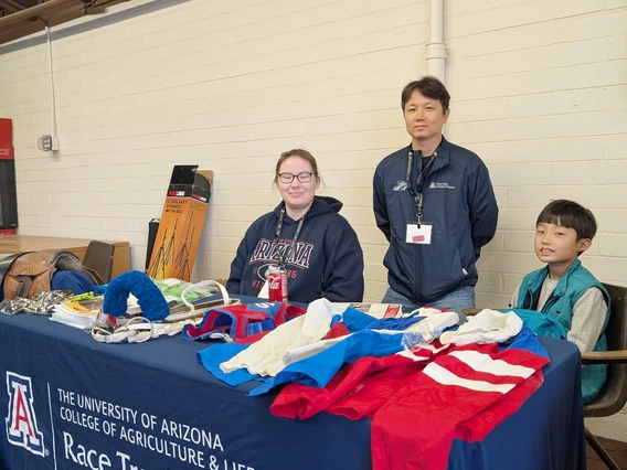 Two students at display table