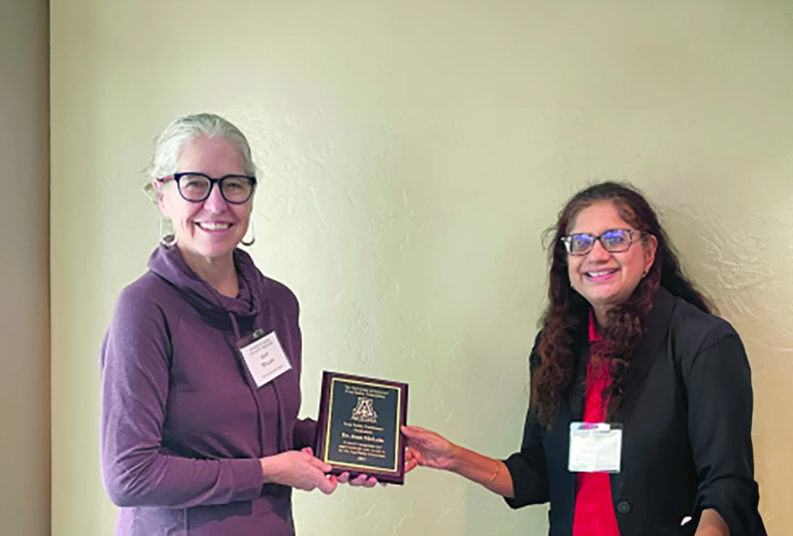 Photo of Jean McClain with Award