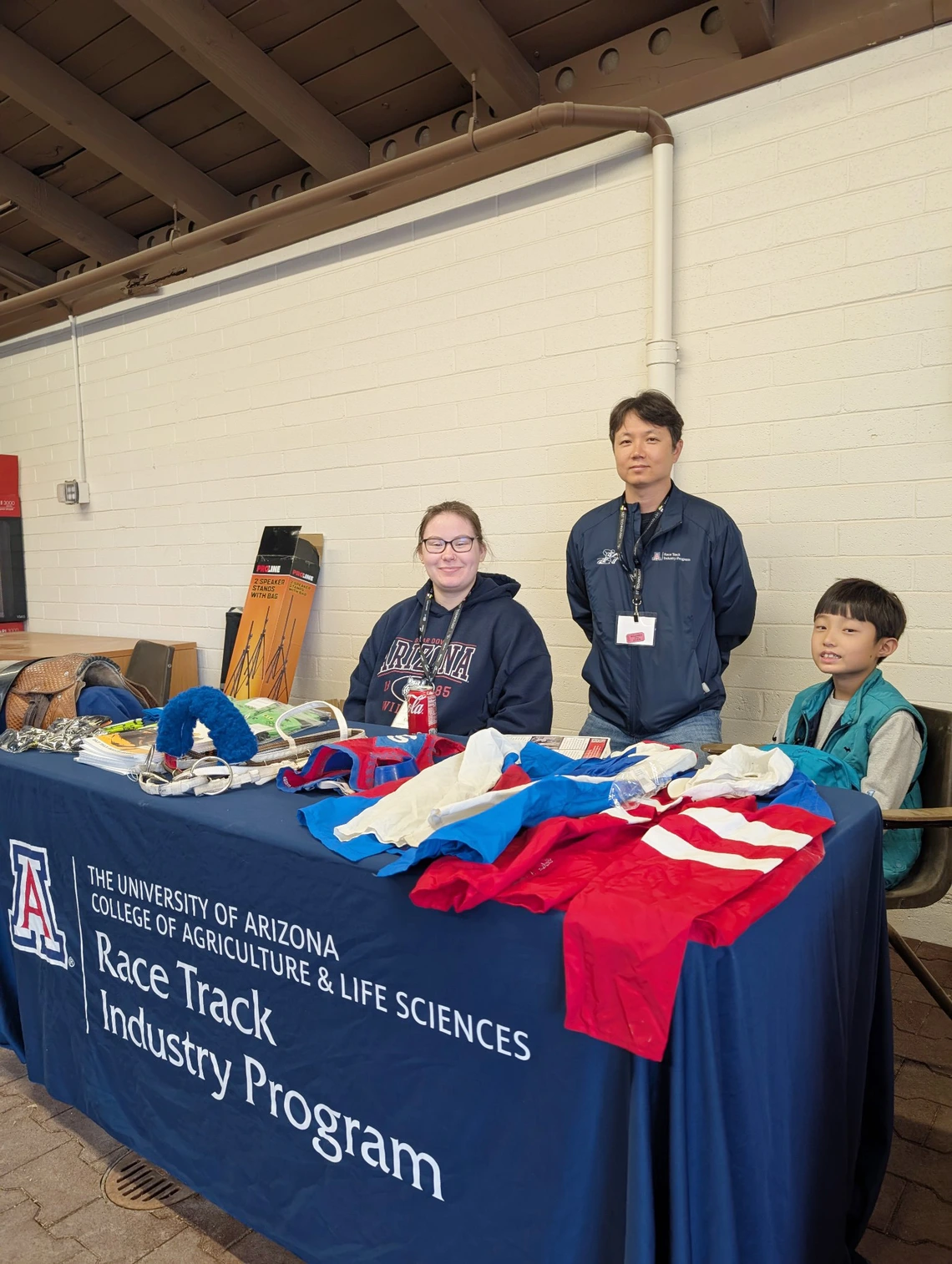 Two students at display table