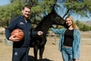 Coach Lloyd posing with his daughter, Maria, and Coach Lloyd's Legacy